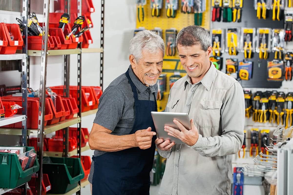 Salesperson,And,Customer,Using,Tablet,Computer,In,Hardware,Store